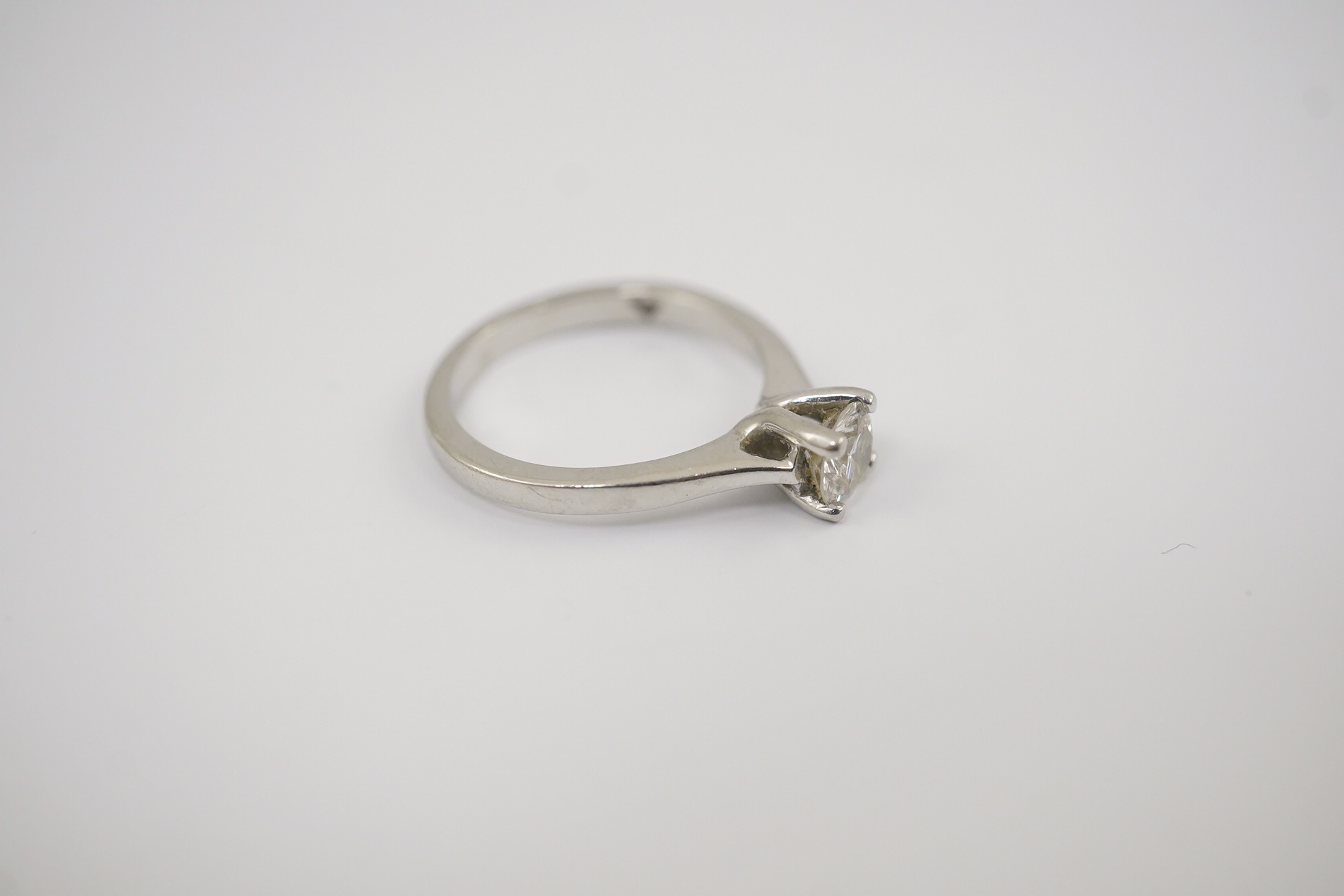 A modern platinum and solitaire diamond set ring